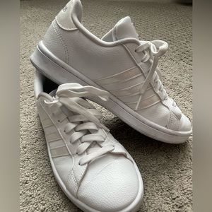 Woman’s white tennis shoes